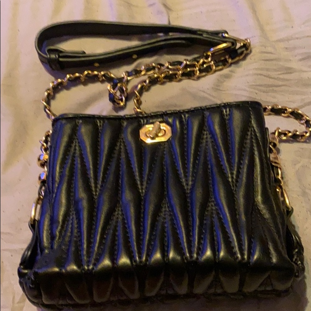 Black crossbody or shoulder bag.
